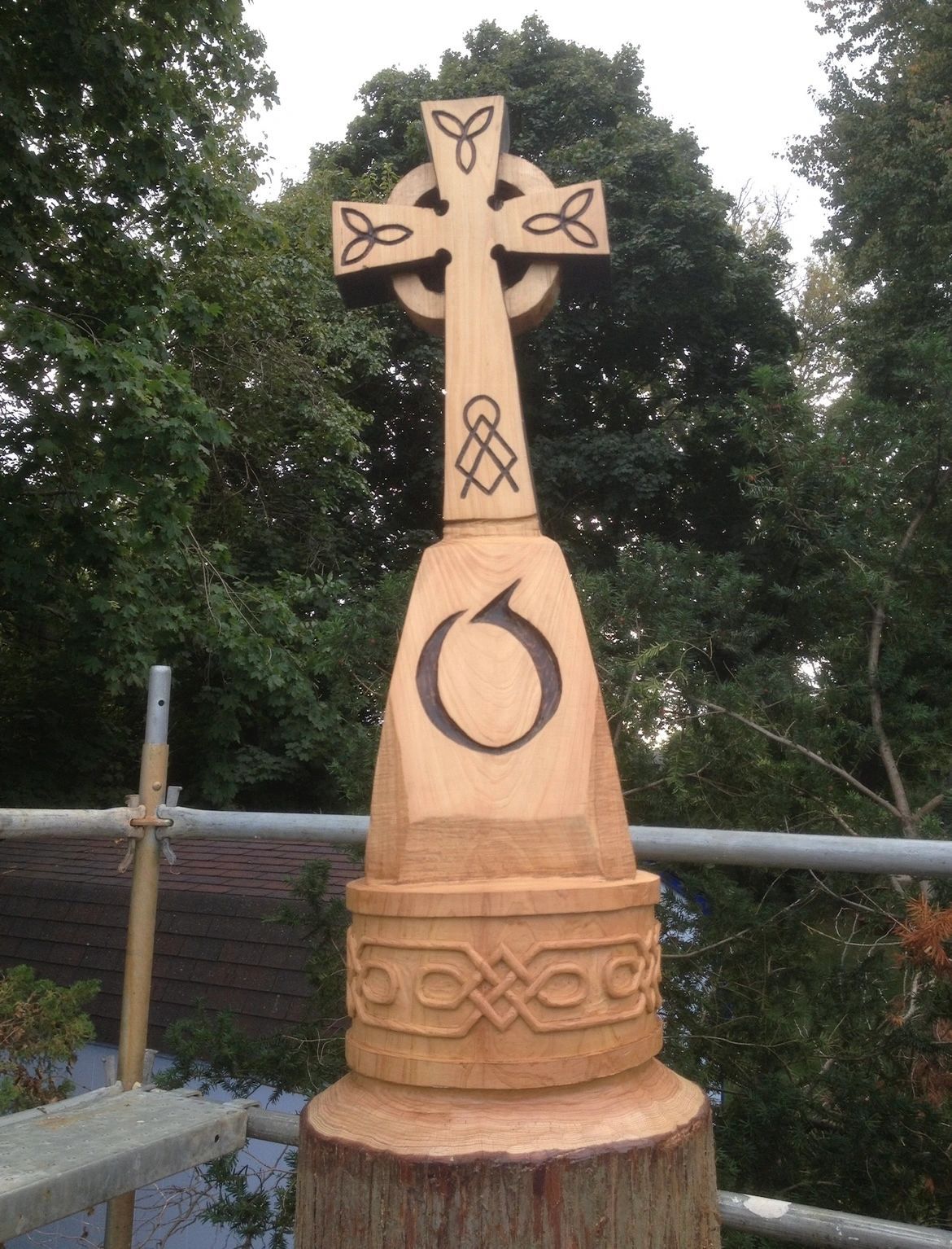 Celtic cross. Carved in place from a standing trunk.
