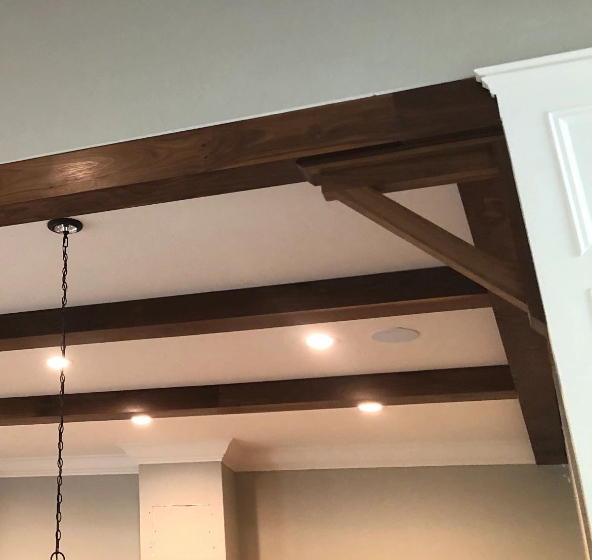 Beams and brackets. Box beams with timber knee braces.