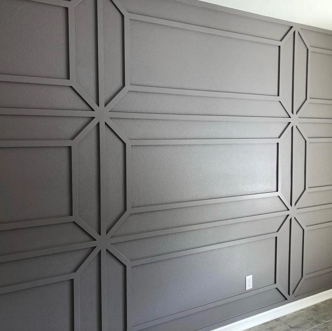 Charcoal panel wall. Picture-frame panels with diamond accents.