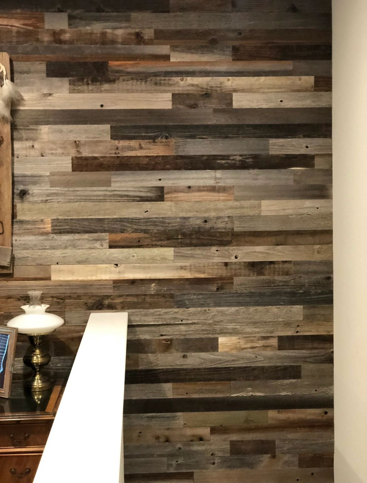Reclaimed barnwood. Mixed-tone reclaimed boards, floor to ceiling.