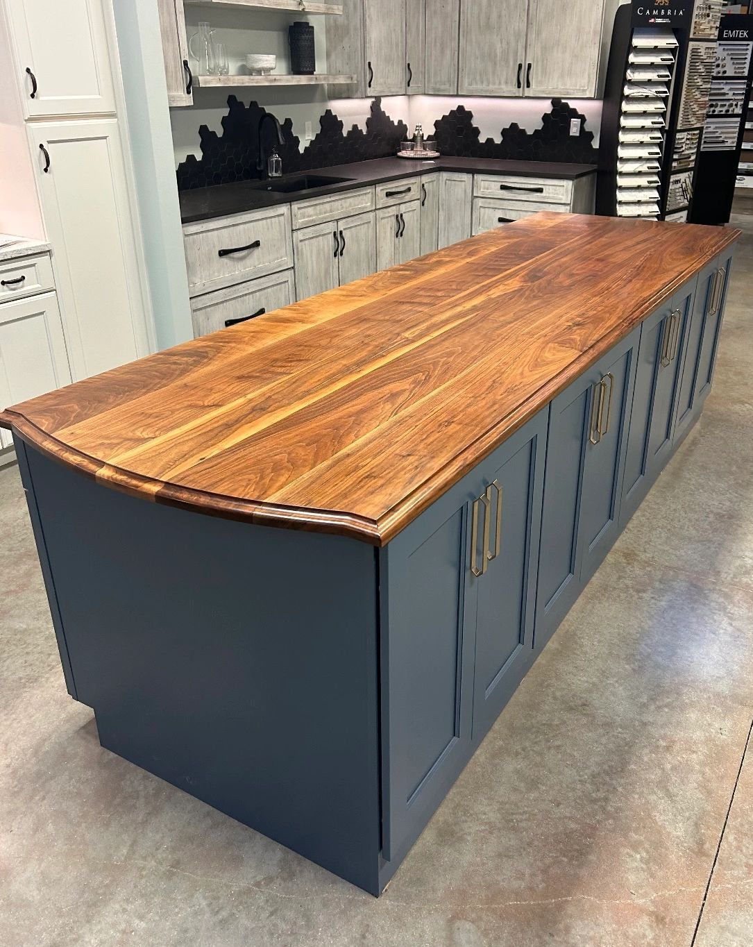 Showroom island. Walnut island top with a curved, profiled end.