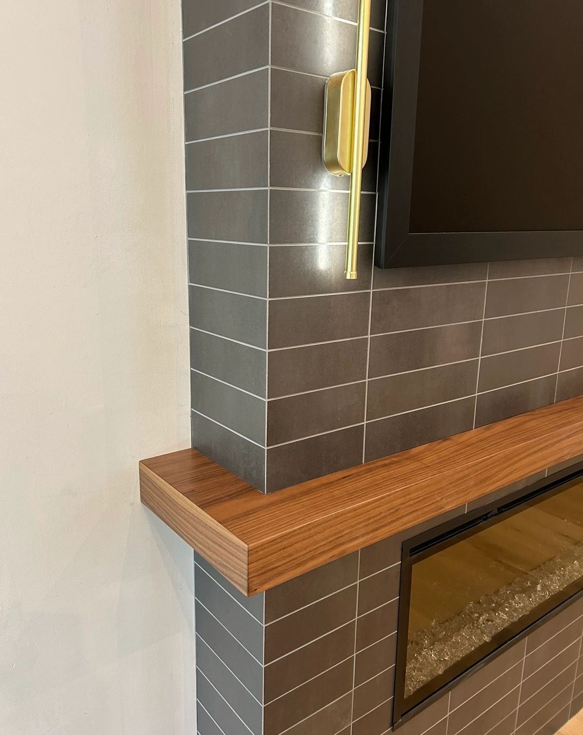Floating Slab Mantel: walnut mantel detail