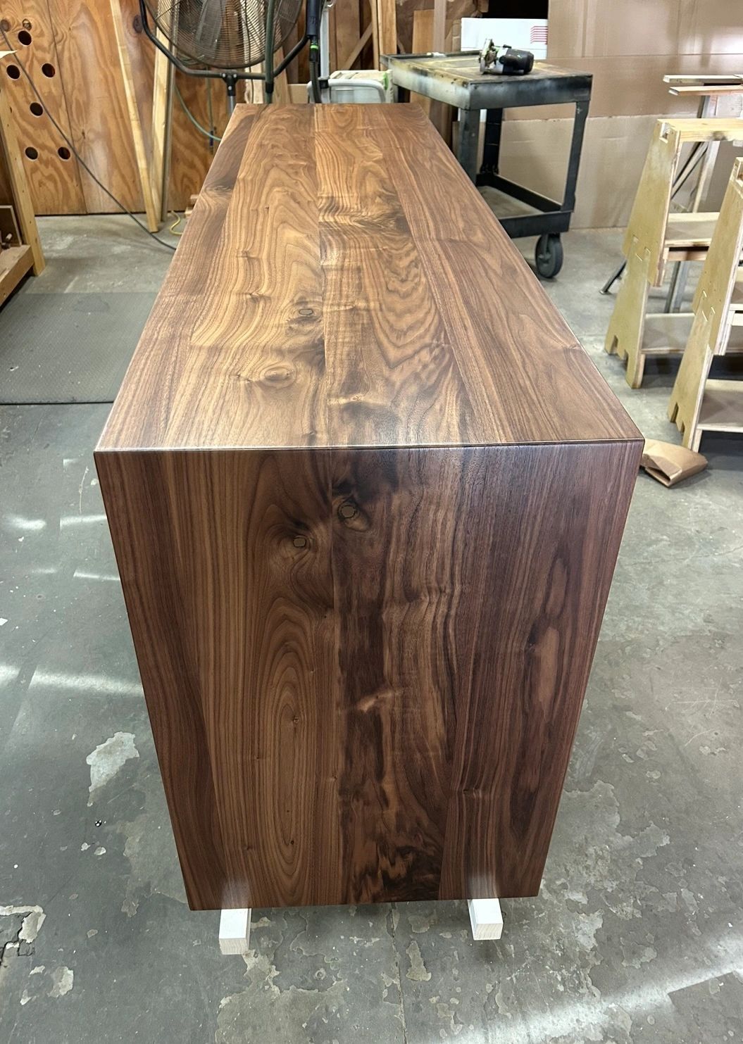 Bookmatched waterfall. Walnut waterfall with the grain wrapping the corner.